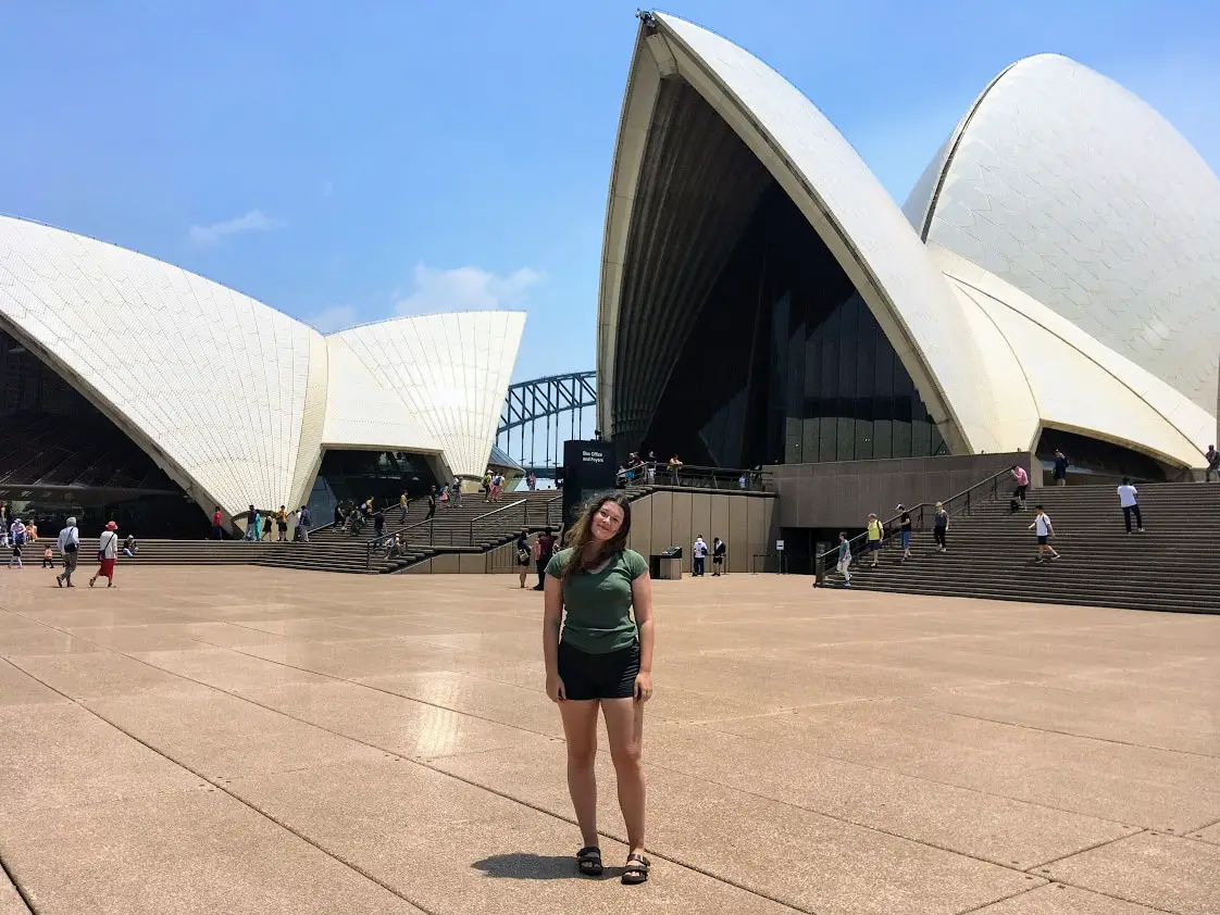 Girl standing in front of Sydney Opera House in December 2019