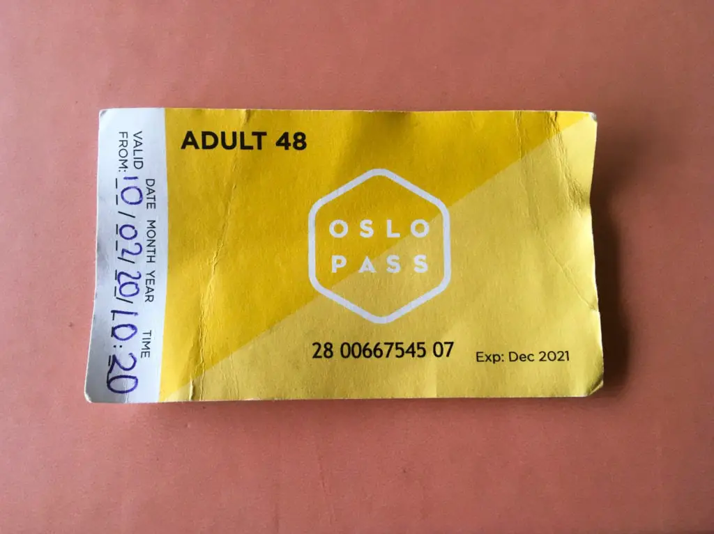 Yellow paper Oslo Pass, a discount travel card that is a great way to save money on a weekend trip to Oslo.