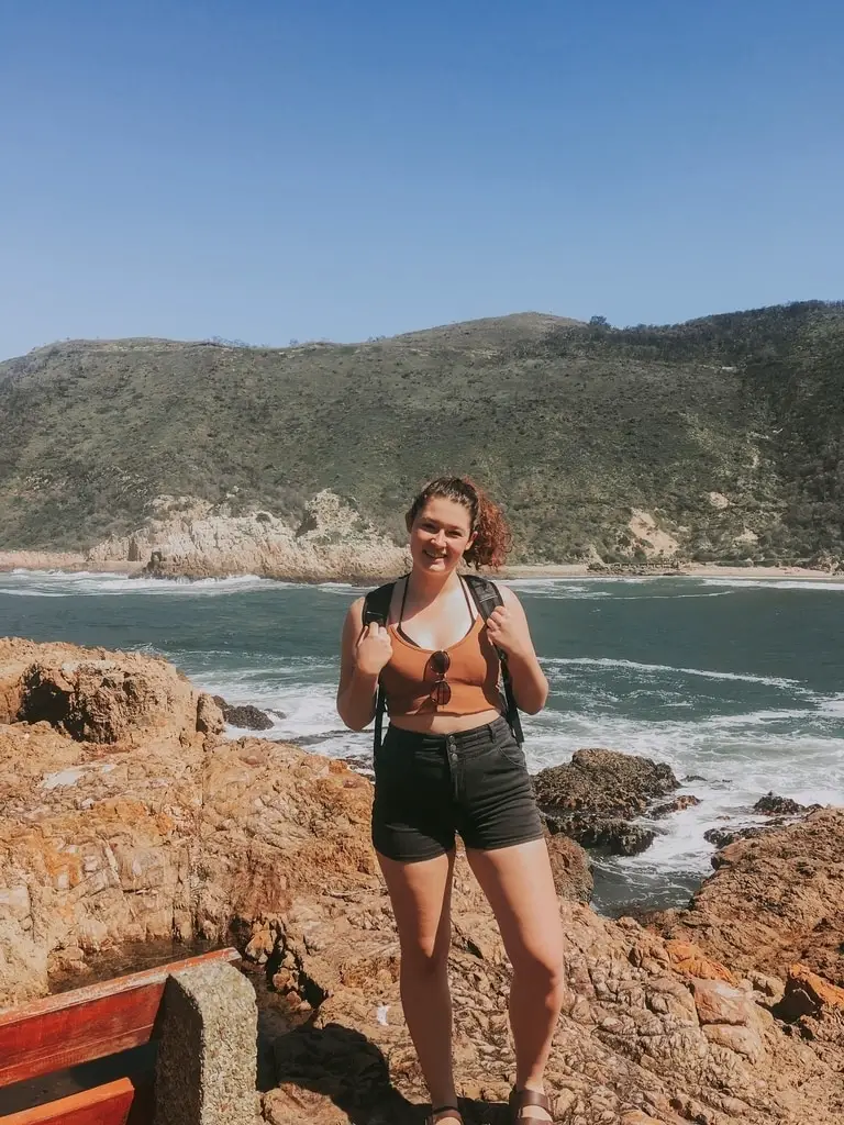 girl standing at Knysna Heads in South Africa
