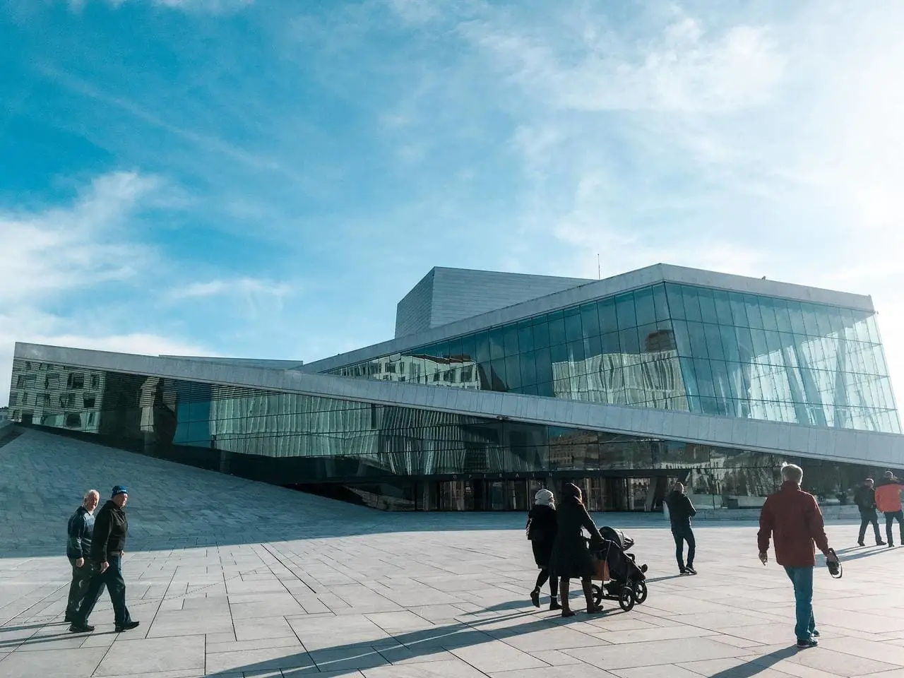 The glass exterior of the Oslo Opera House drenched in the sun. This is an unmissable stop on this 2 days in Oslo itinerary.