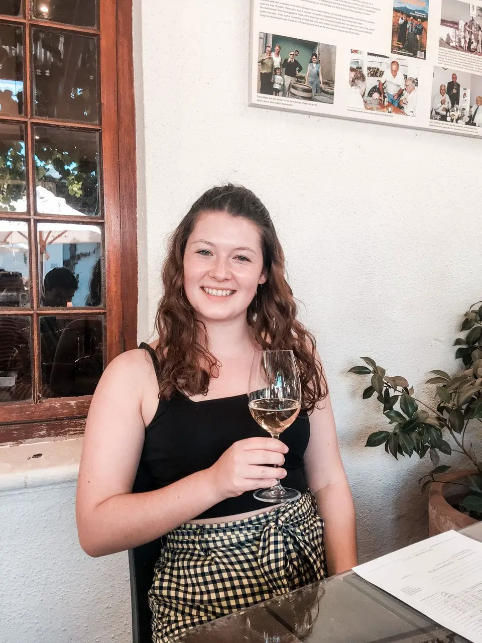 Girl drinking wine on a Stellenbosch wine tour
