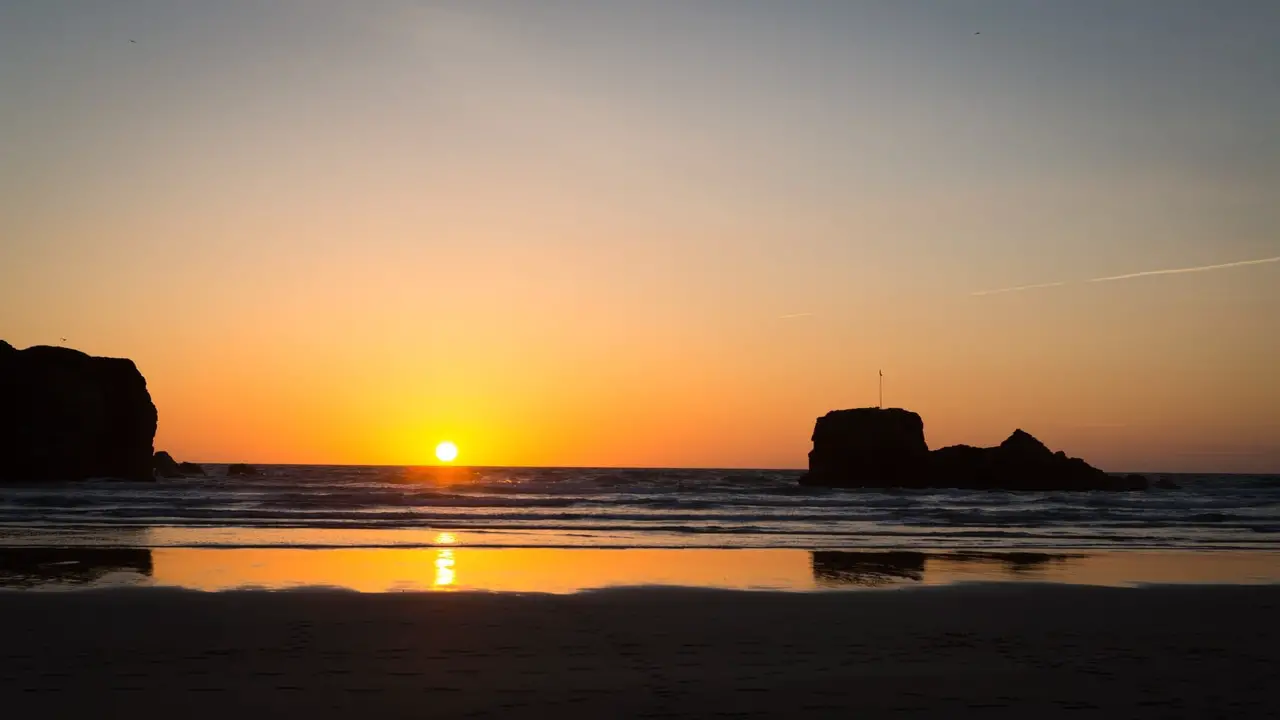 Sunset at Chapel Rock in Perranporth, England. Most romantic breaks in Cornwall