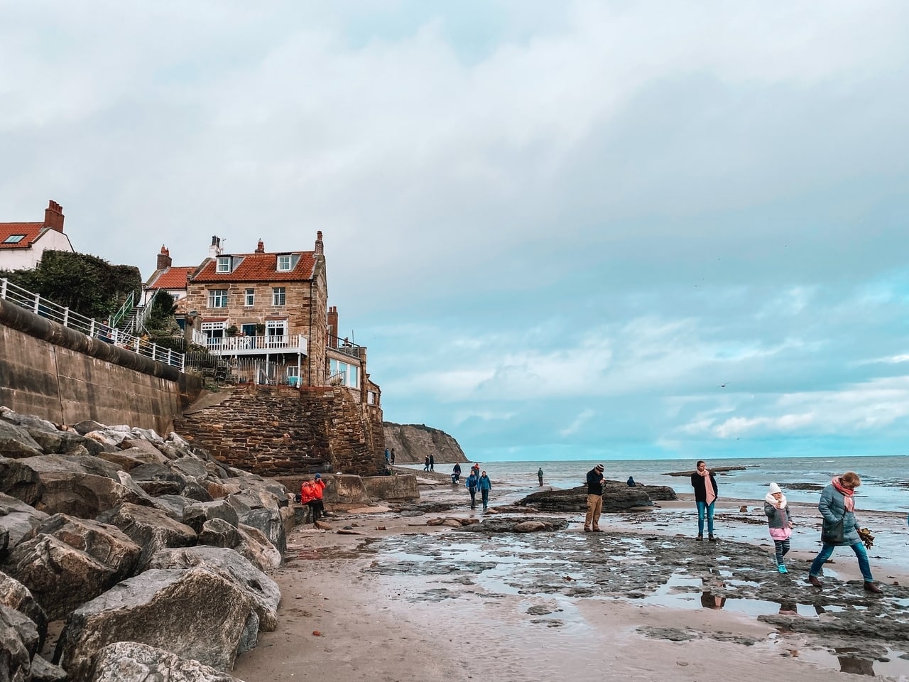 People playing on the beach at Robin Hood's Bay on the North Yorkshire Coast