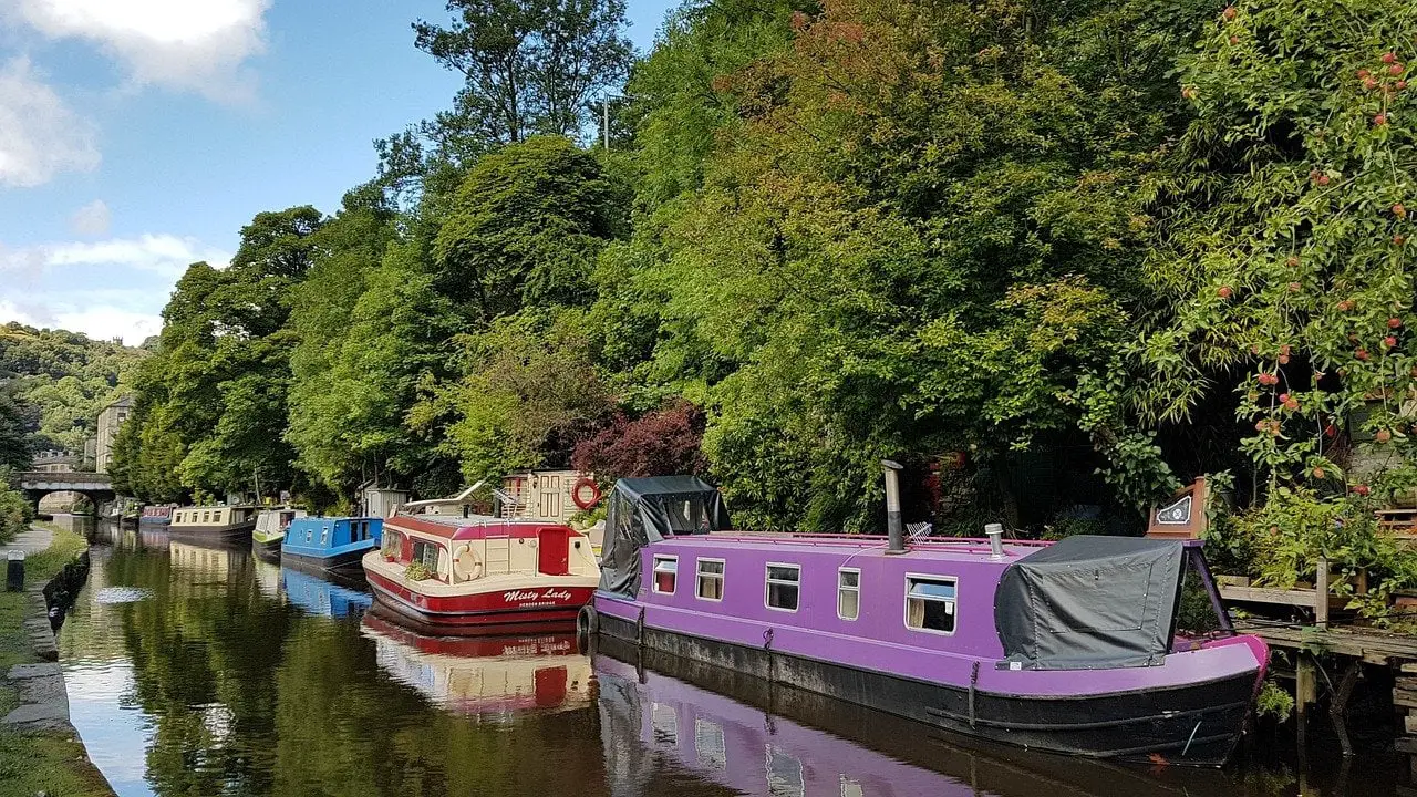 Hebden Bridge canal with colourful barges