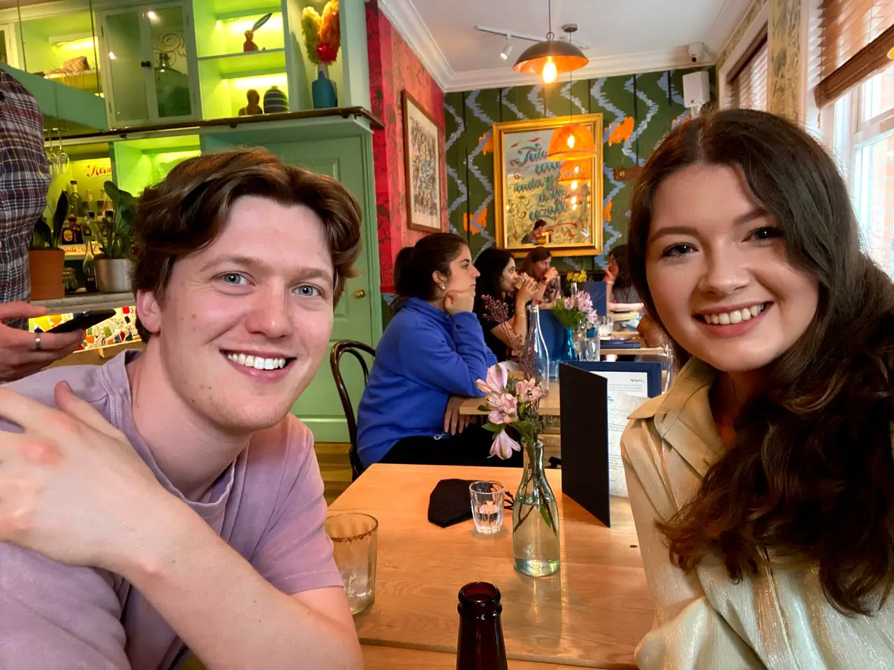 Ella and Rob visiting a restaurant in London - where the food prices are pretty high!