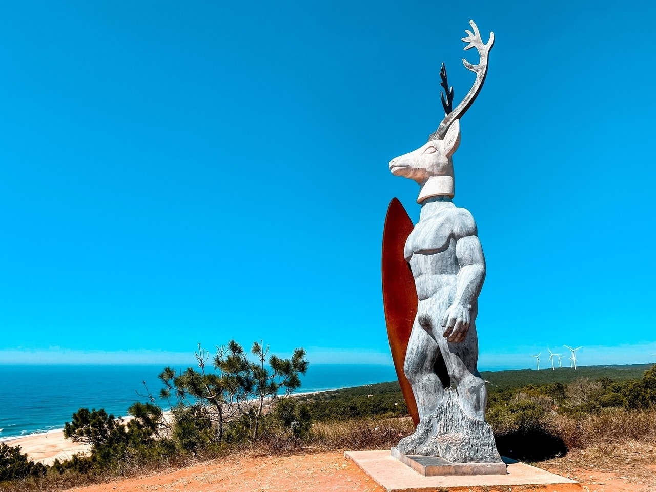 A sculpture and viewpoint overlooking the beach in Portugal.