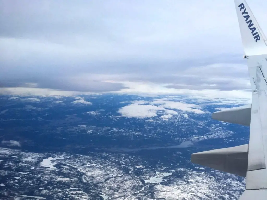 View over snowy Norwegian landscape from a Ryanair flight to Oslo from London