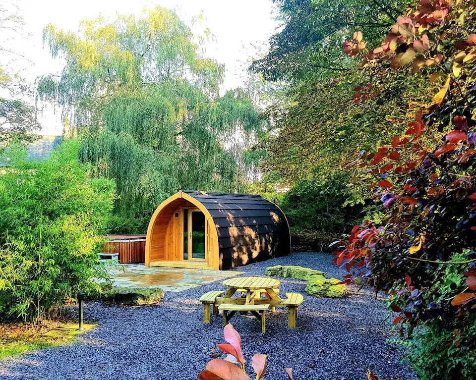 Wooden camping hut in a garden
