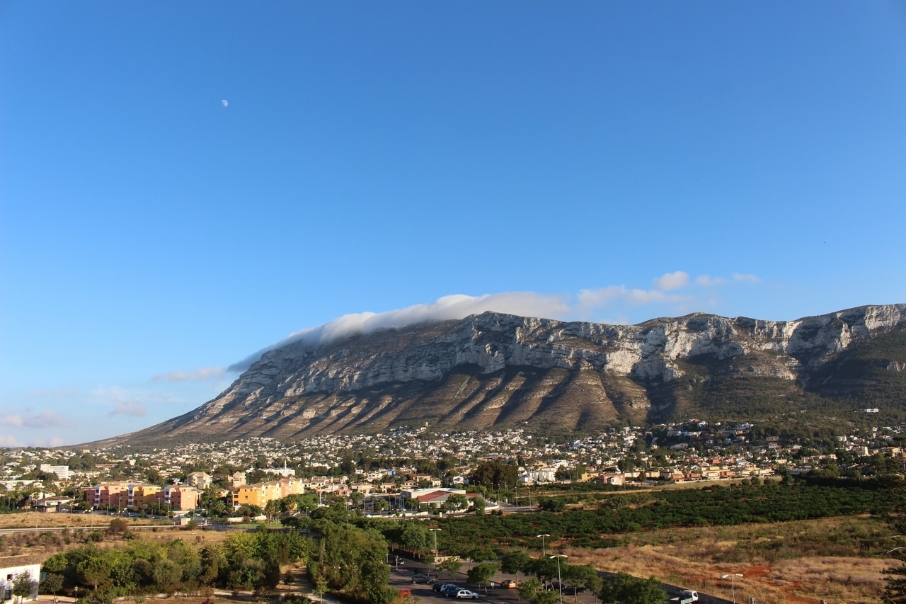 Montgo mountain towering over the town and houses of Denia Spain