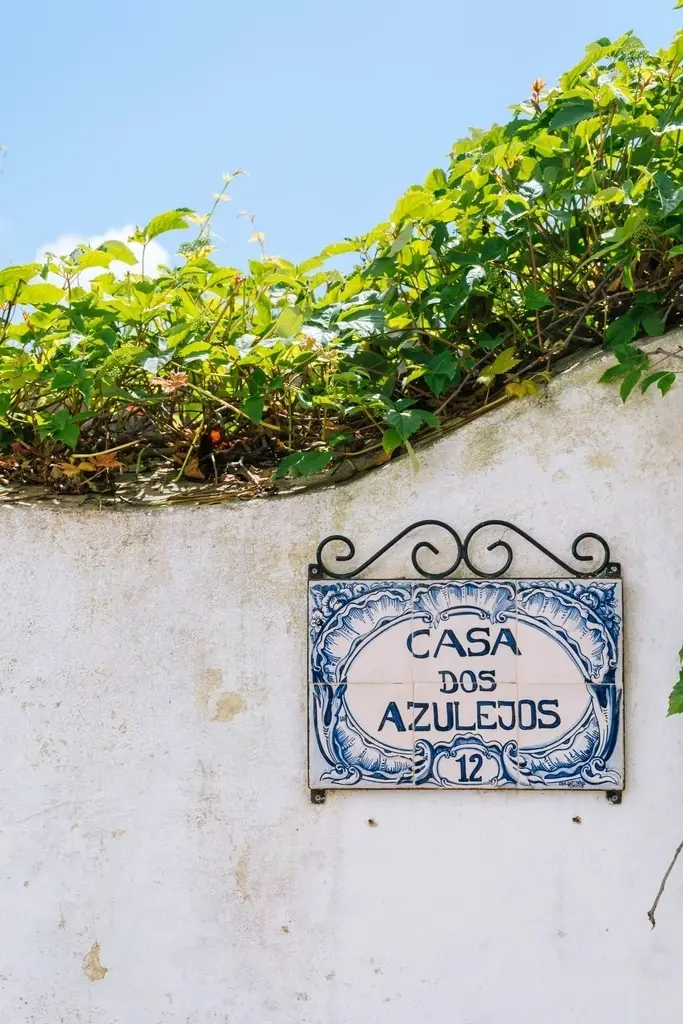 A blue house sign in Obidos, Portugal, which says "Casa dos Azulejos".