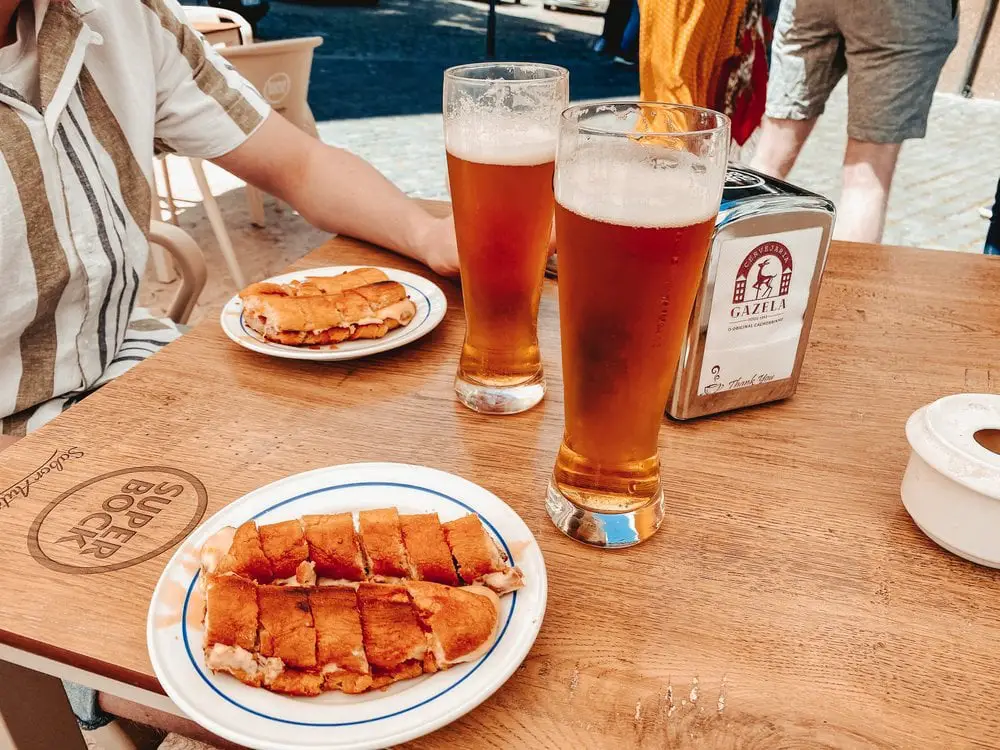 Sampling Cachorrinhos (Portuguese hot dogs) at Carvejaria Gazela, one of the Anthony Bourdain restaurants in Porto