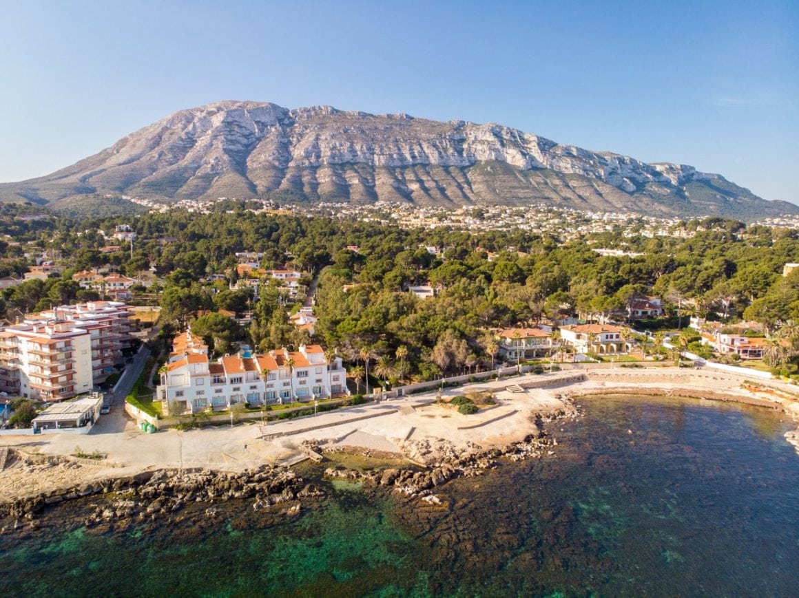 Drone view of Denia shoreline and beach with the Montgo mountain in the background.