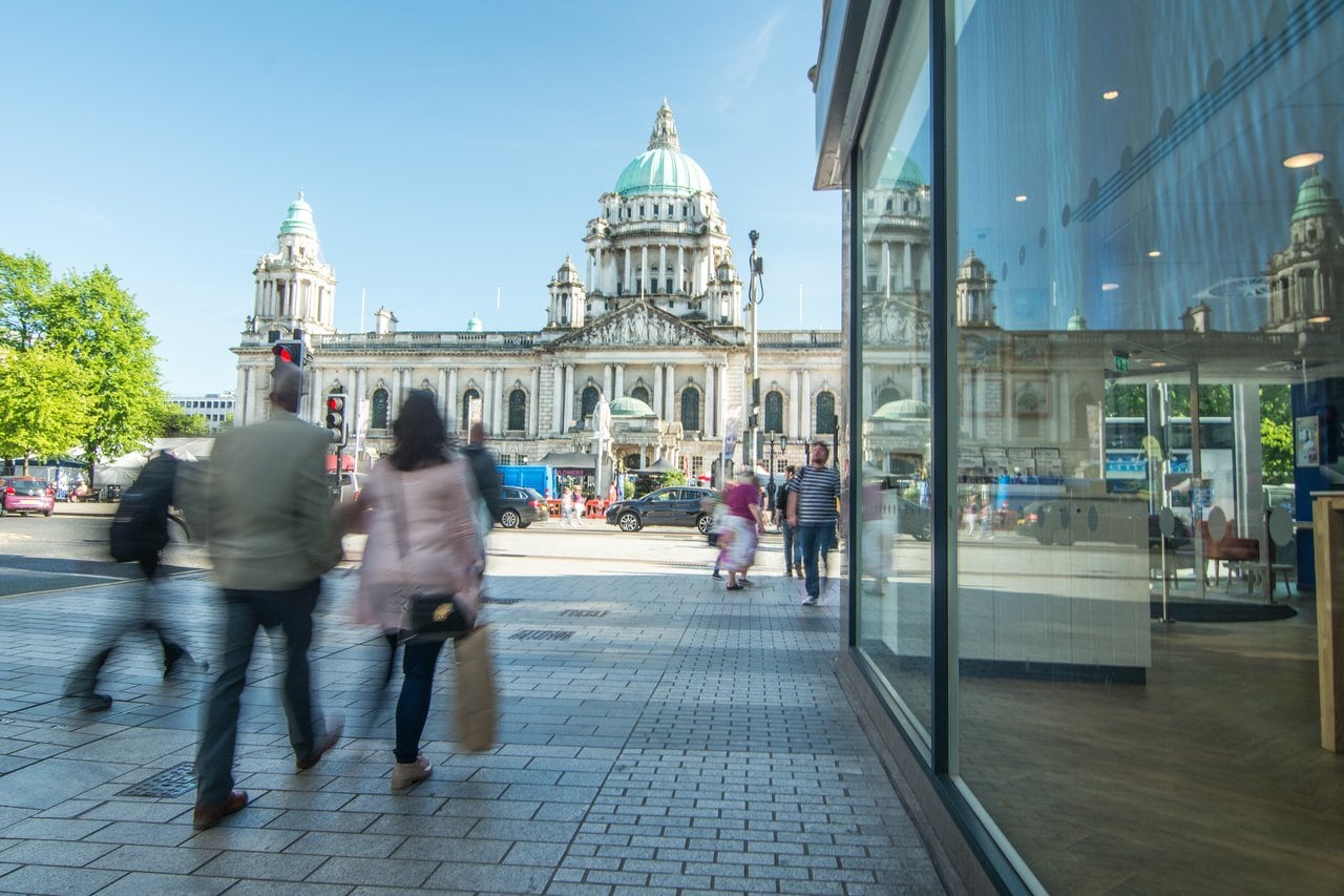 People shopping in front of a town hall in Northern Ireland