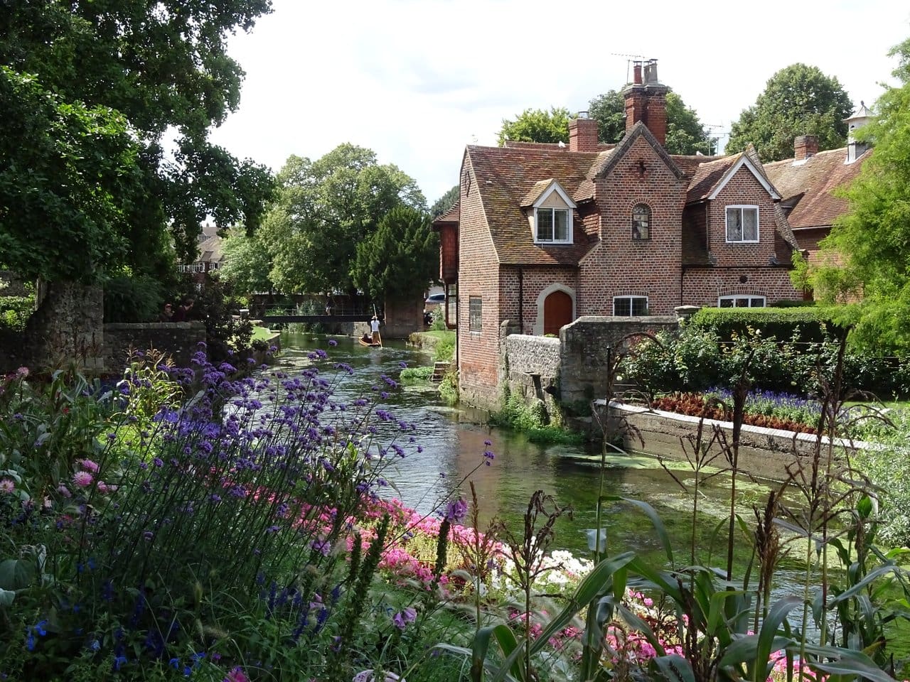 English town with river and flowers