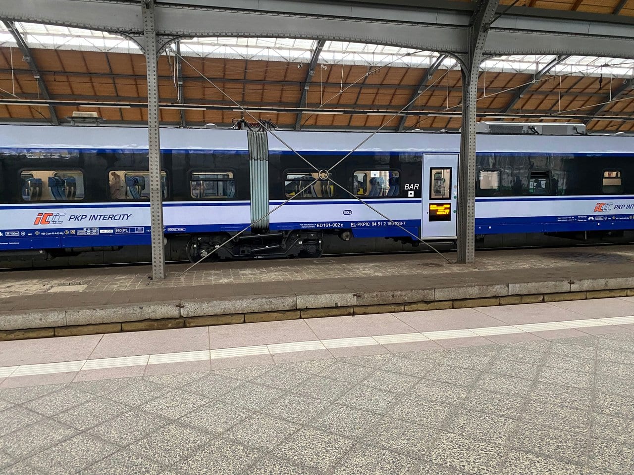 The exterior of the ICCC PKP Intercity train at a train station in Poland. Getting around the country in Poland is very cheap.