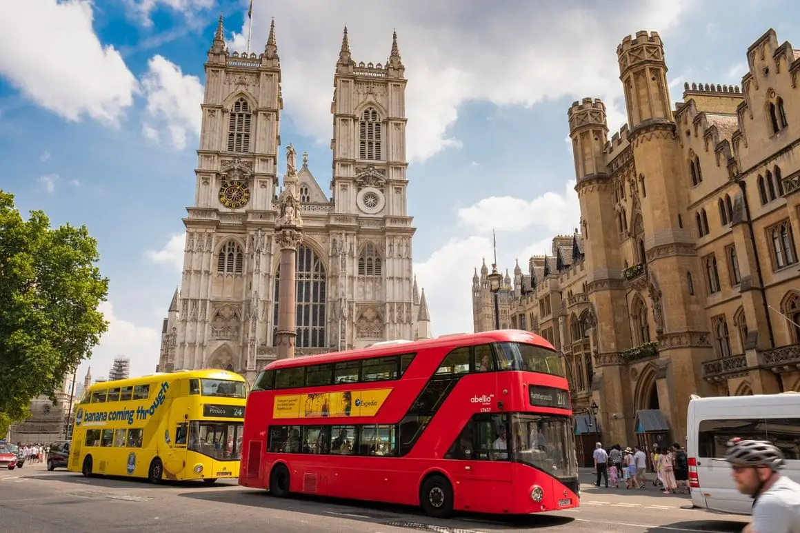 Westminster abbey with red and yellow bus