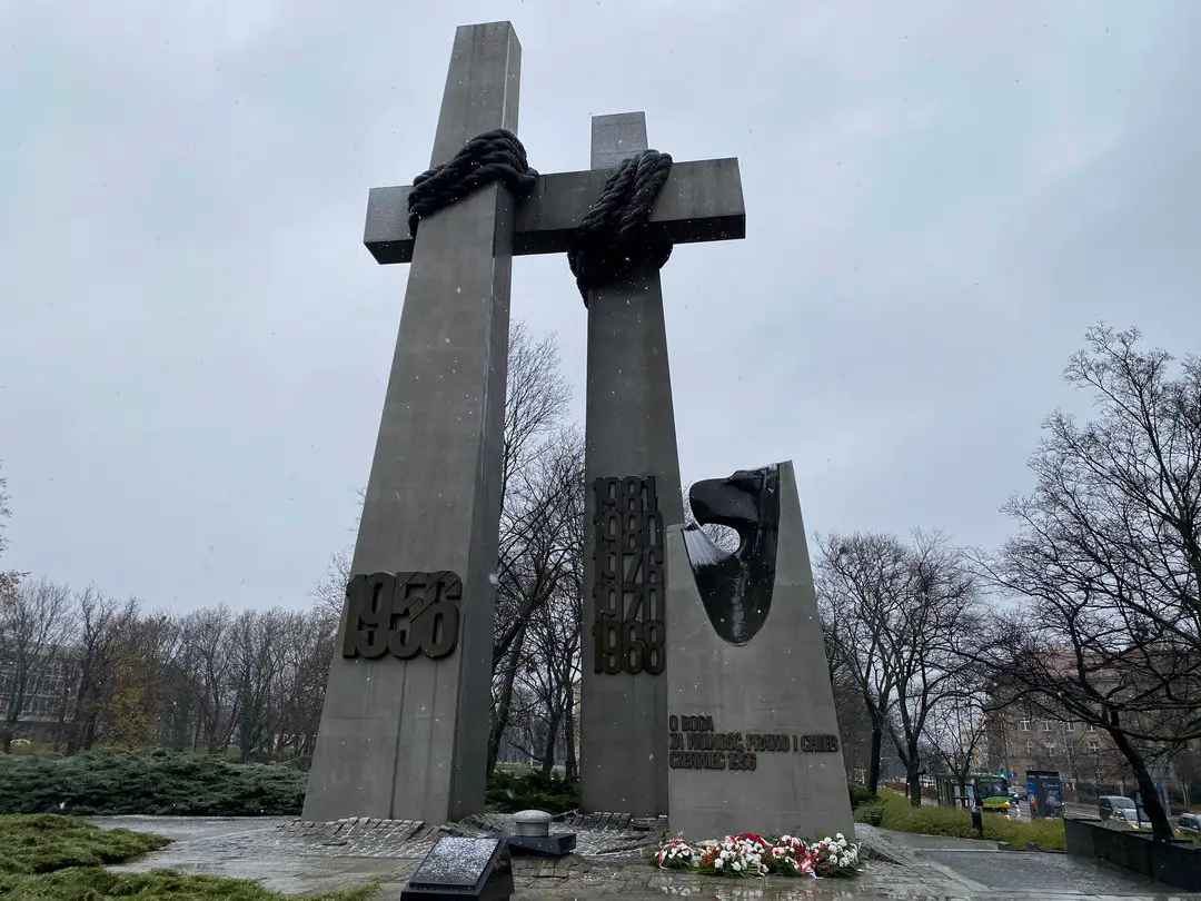 The sombre Poznan Crosses Monument at Adam Mickiewicz Square commemorating the June 1956 protests, a poignant historical site to reflect on during a visit to Poznan.