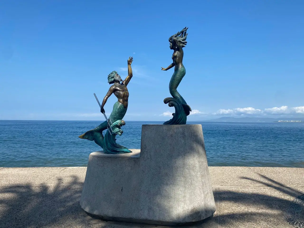 Sculptures in front of ocean