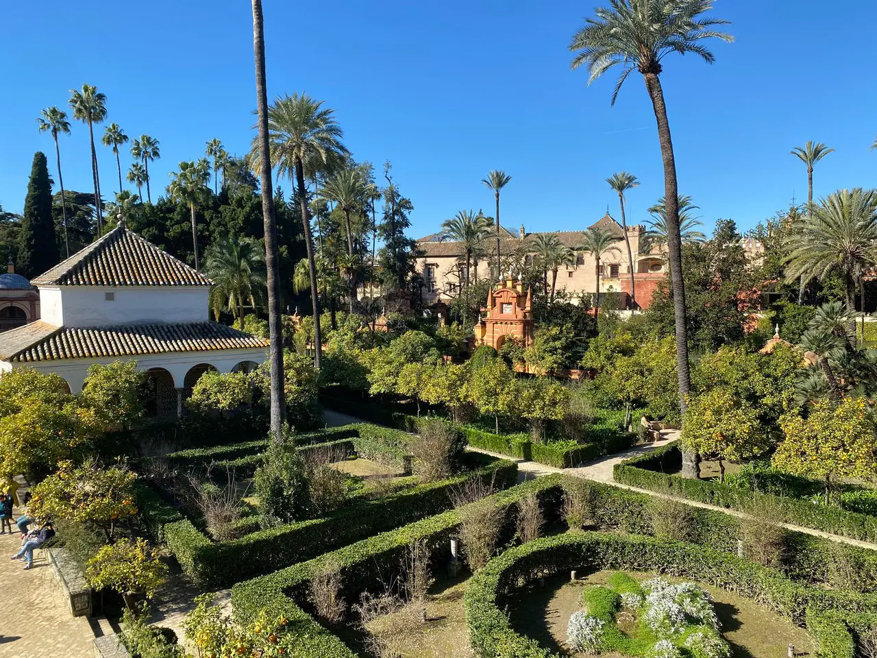 Gardens, including a small maze, at the Seville Alcazar, one of the best things to do on this 2 days in Seville itinerary.