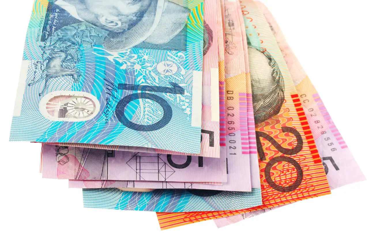 Currency in Australia - different denominations of Australian Dollar on white background