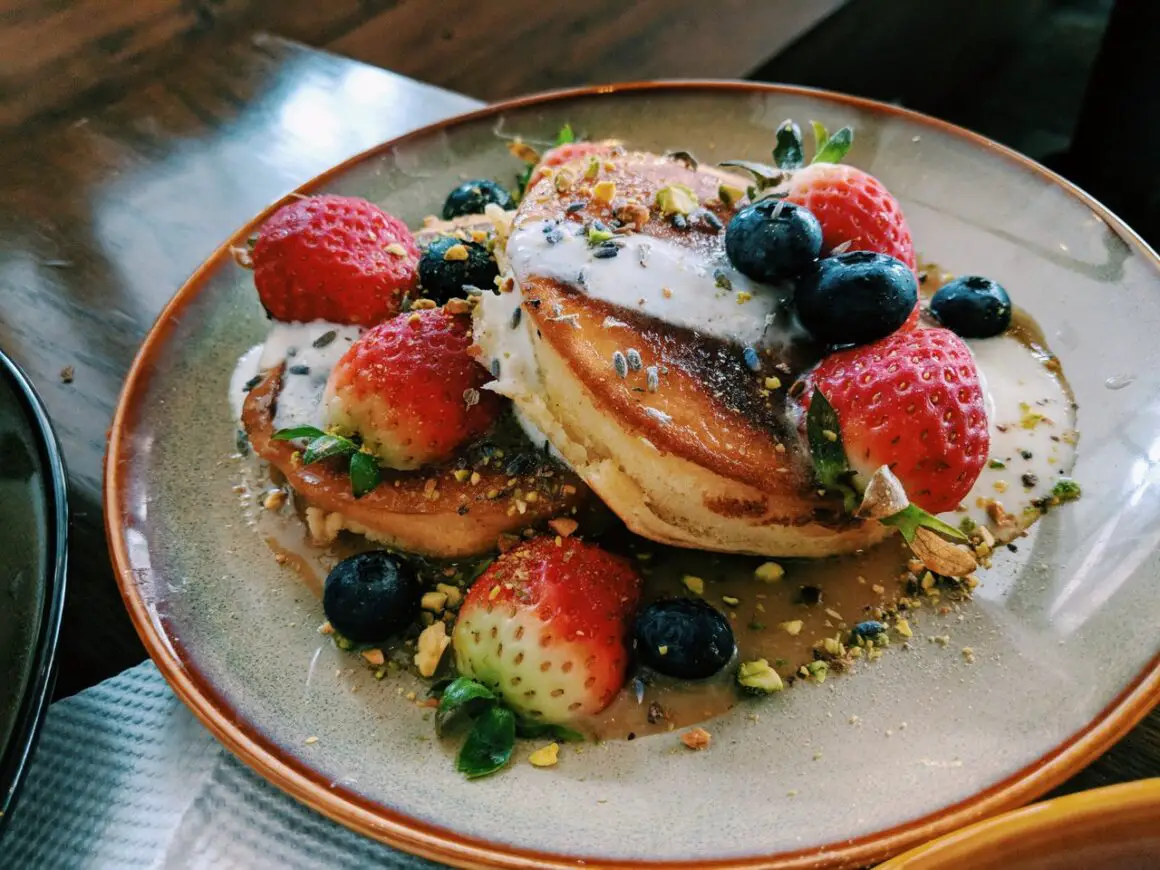 Strawberries and blueberries on pancakes