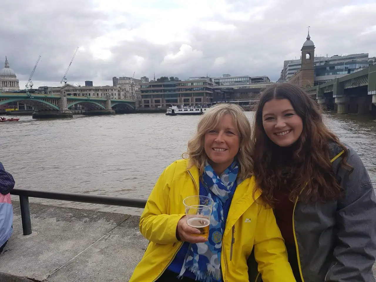 Ella and her mum enjoying drinks on the River Thames in London