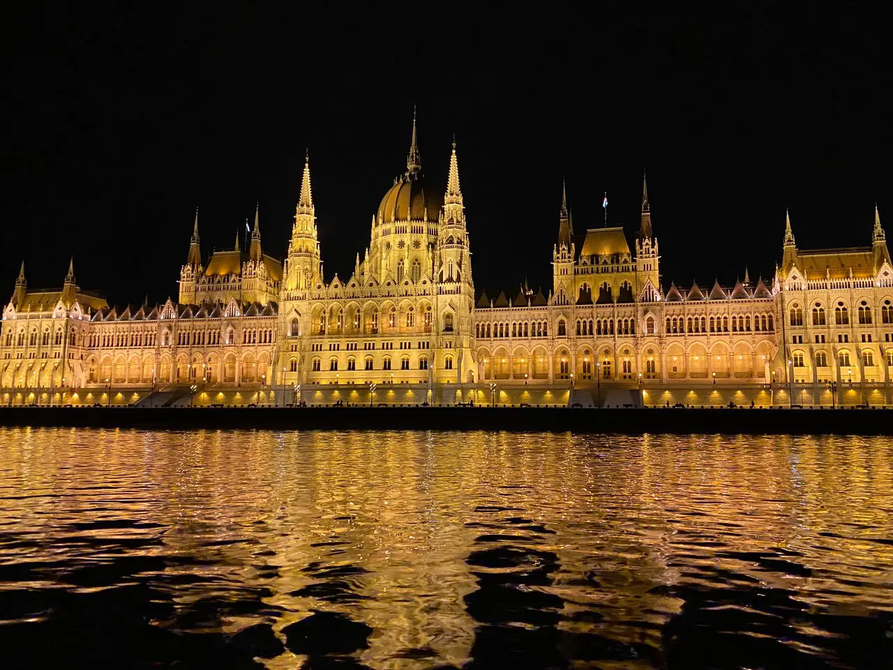 View of Hungarian Parliament at night on a cruise in Budapest