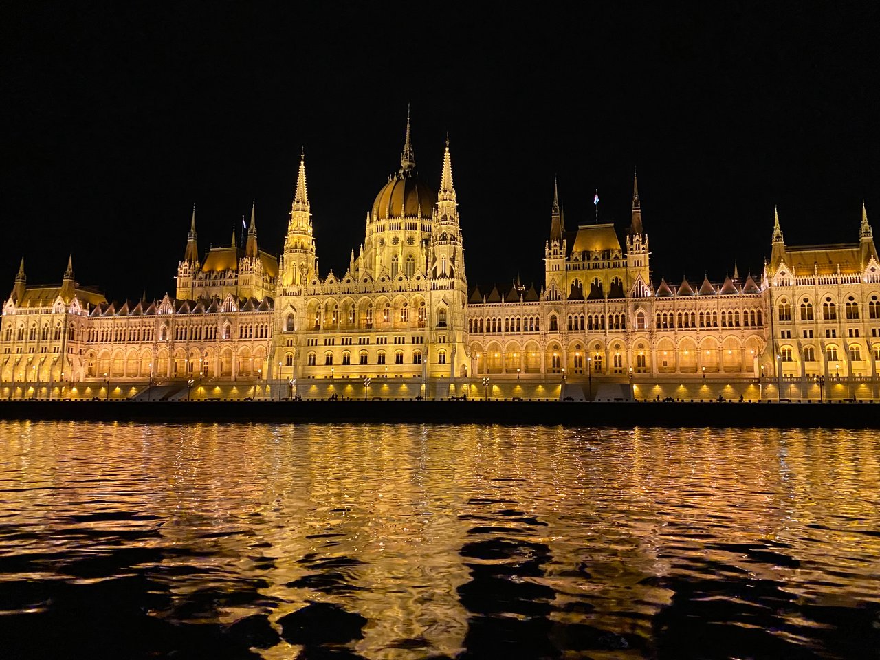 View of Hungarian Parliament at night on a cruise in Budapest