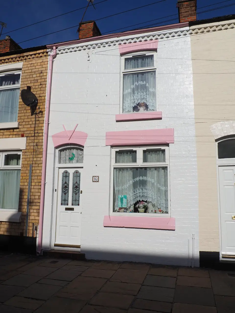 A pink and white terraced house at 10 Admiral Grove, which was Ringo Starr's Childhood Home