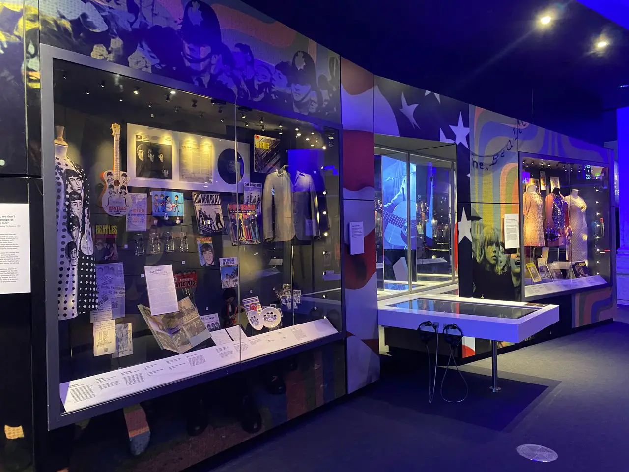 Display cabinet inside the British Music Experience in Liverpool showing Beatles memorabilia.