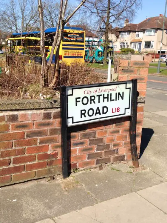 Forthlin Road sign with Magical Mystery Tour bus in the background