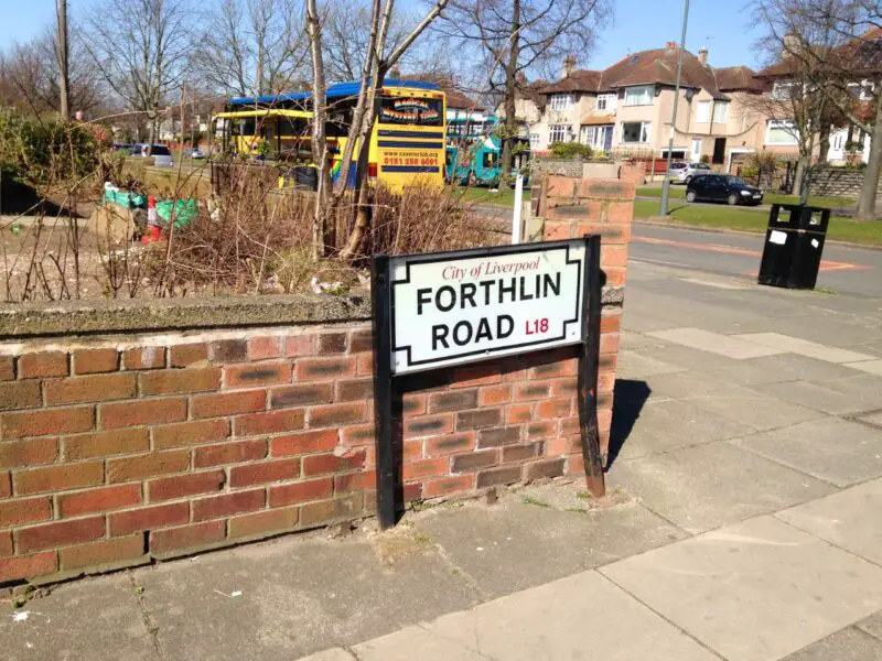 Forthlin Road sign with Magical Mystery Tour bus in the background