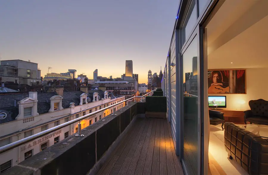 Views over the Liverpool skyline at sunset from the balcony of the Lennon Suite at the Hard Days Night Hotel