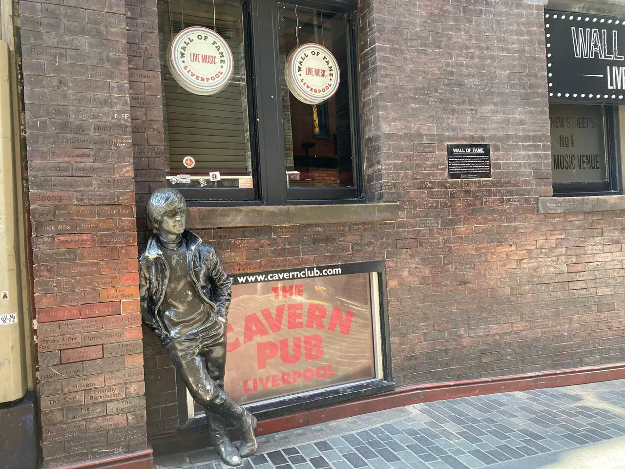 John Lennon Statue leaning against a wall near the Cavern Club, Liverpool