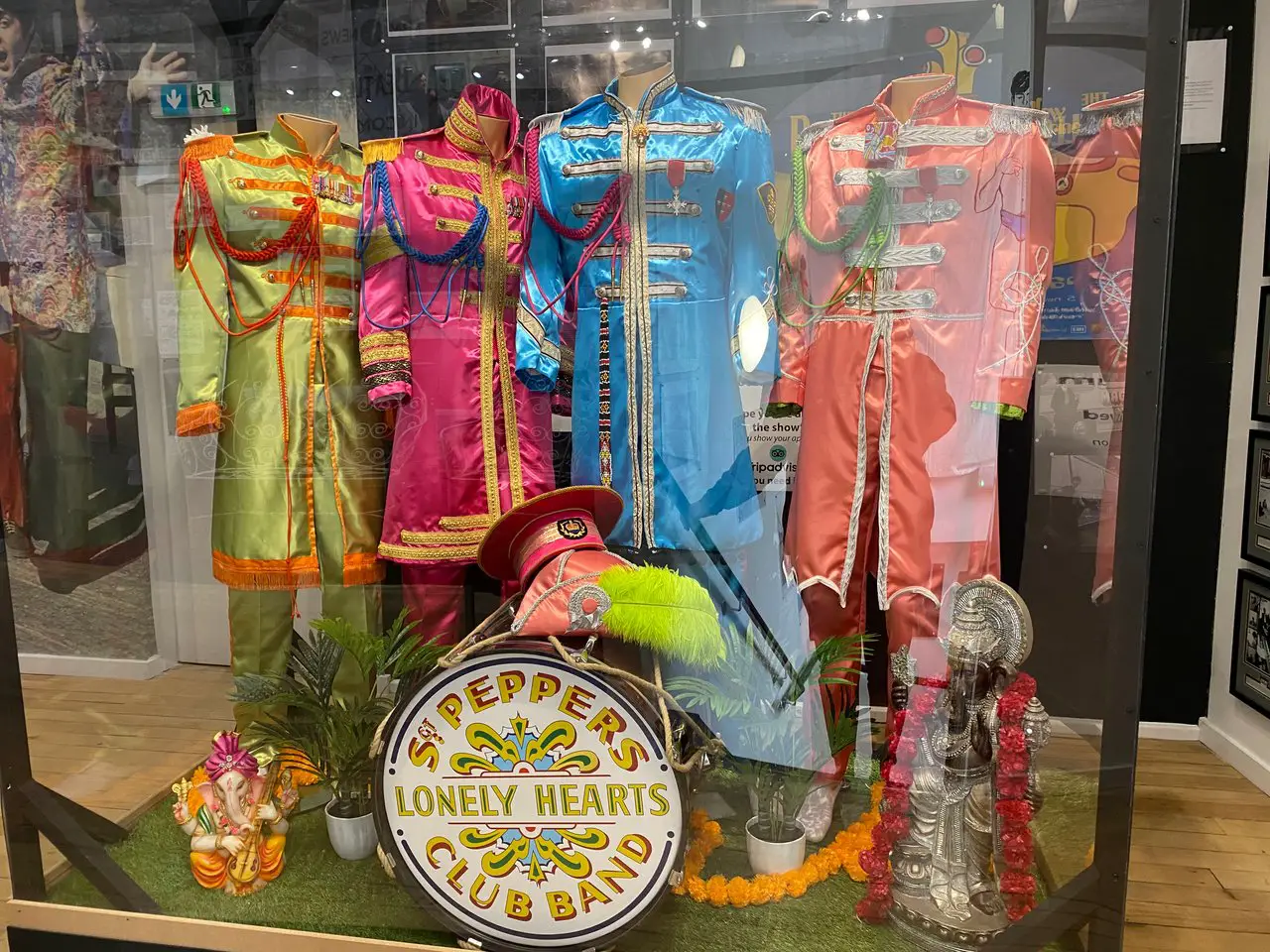 Display case showing the Sgt Pepper's outfits at the Magical Beatles Museum in Liverpool