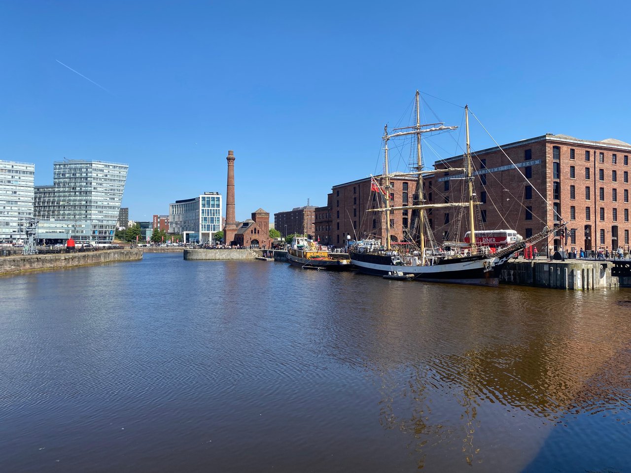 Views over historic Albert Dock in Liverpool in summer, with boats in the water