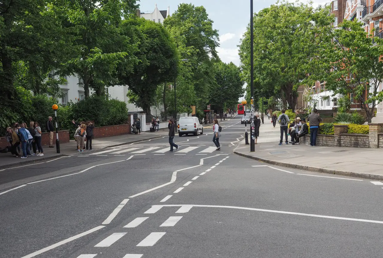 The world-famous Abbey road zebra crossing. The Beatles ages were all under 30 when they released the Abbey Road album.