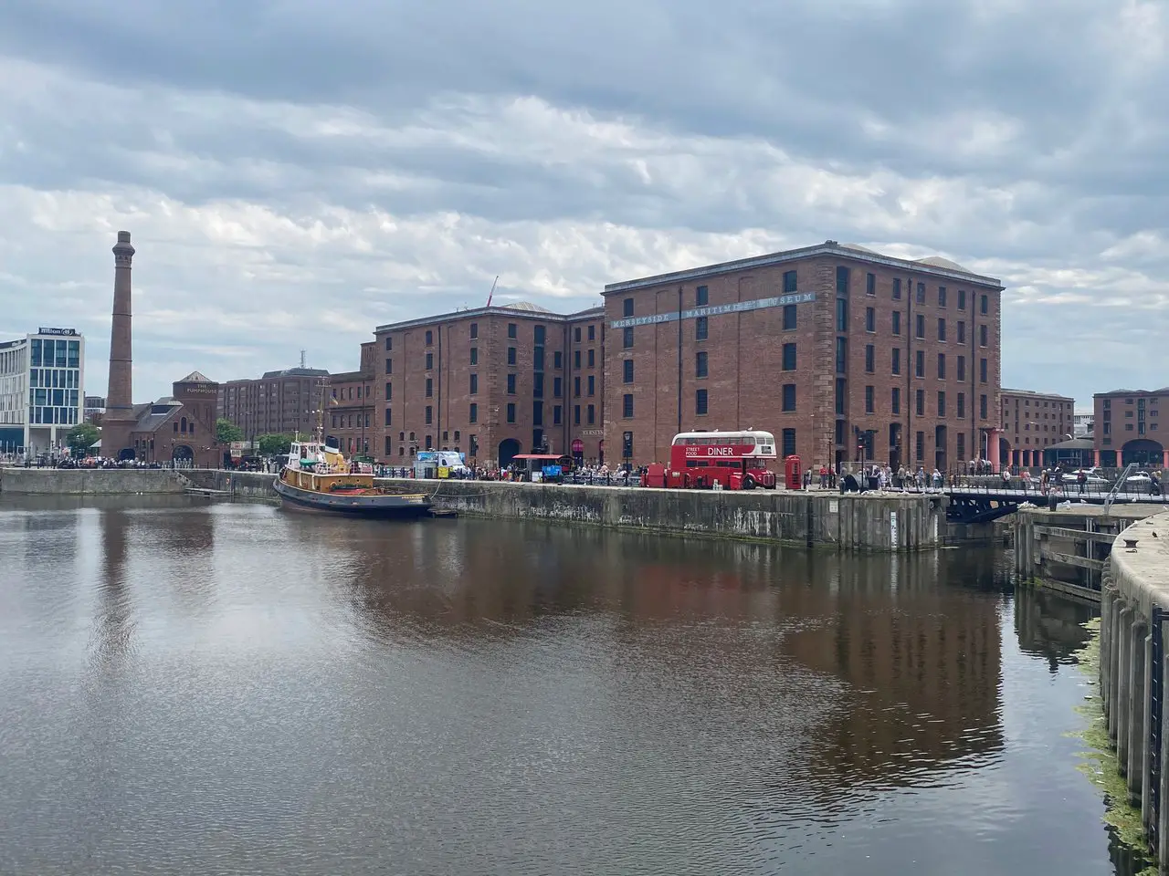 The red brick buildings of the Albert Dock, a former UNESCO site in Liverpool England, on a cloudy and gloomy day