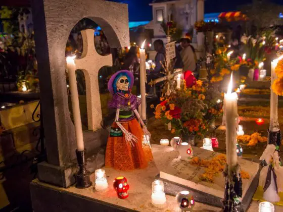 A candellit vigil at Oaxaca cemetery for dia de los muertos. You won't see celebrations like these on Day of the Dead in Spain!
