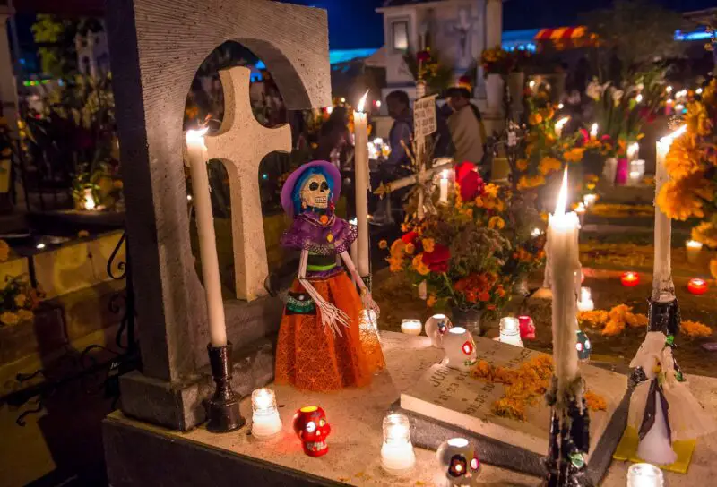 A candellit vigil at Oaxaca cemetery for dia de los muertos. You won't see celebrations like these on Day of the Dead in Spain!