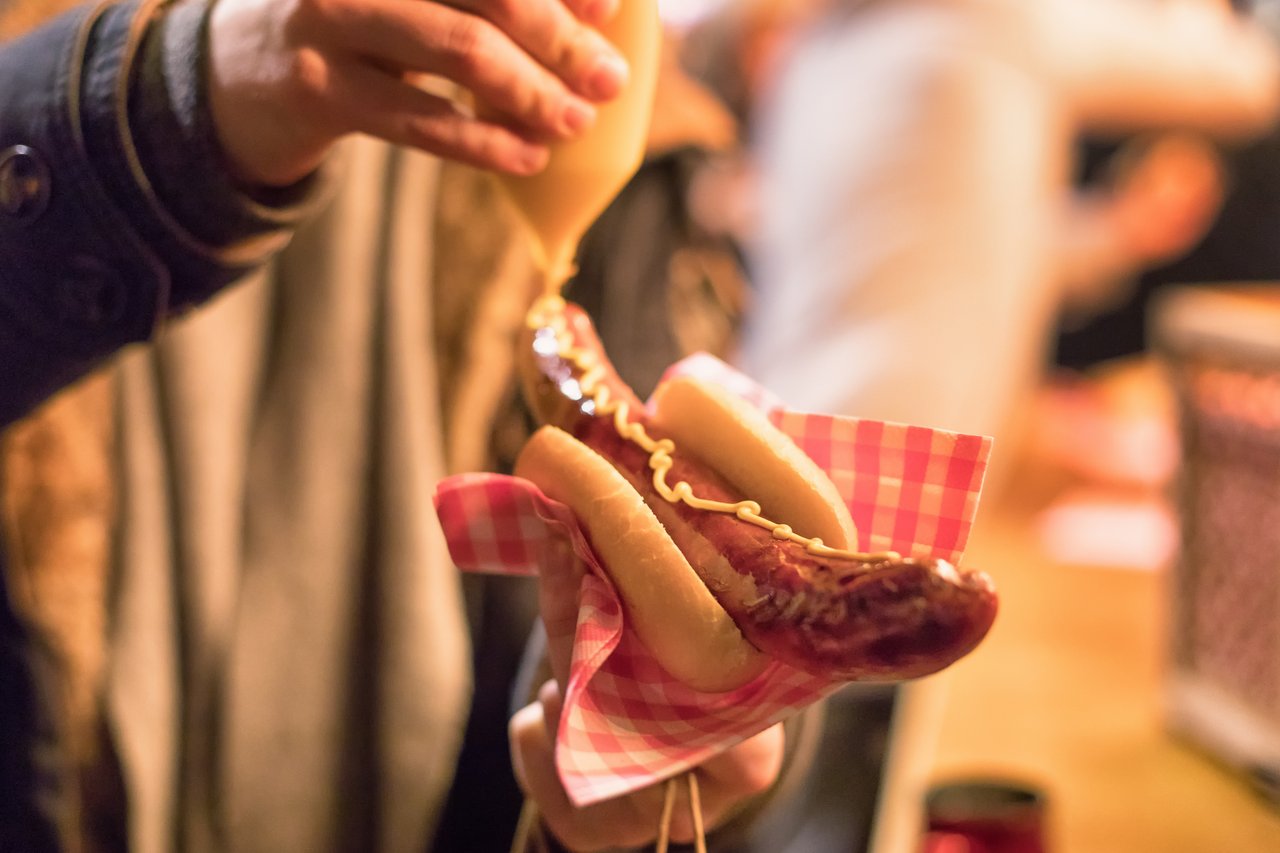 German Bratwurst with mustard, served at the Liverpool Christmas Market