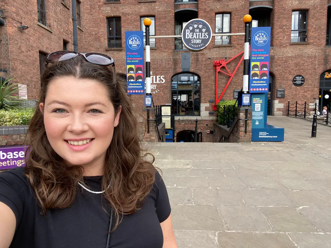 Ella outside Beatles Story Museum Liverpool, one of the top attractions on Liverpool walking tours
