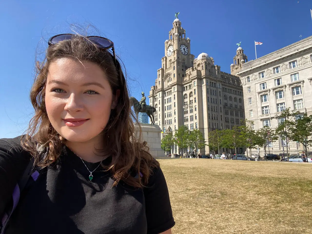 Selfie of Ella at Liver Building in Liverpool on a clear, sunny day