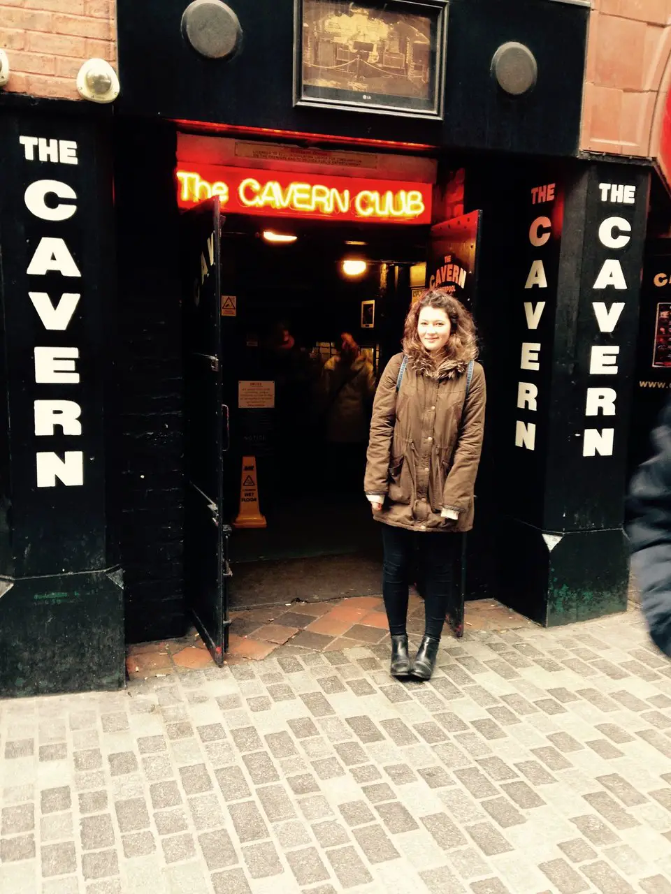 Ella standing outside the entrance to the Cavern Club in Liverpool in winter