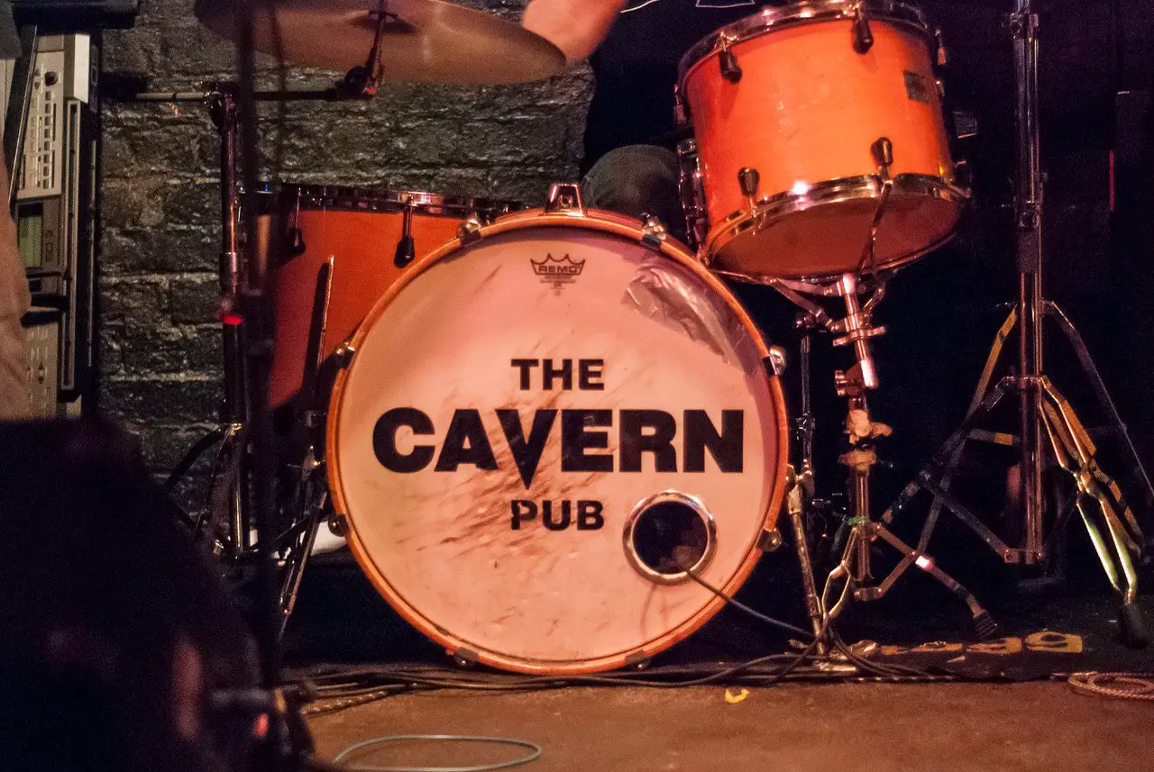 Drum kit with "The Cavern Pub" written on the face of the drum