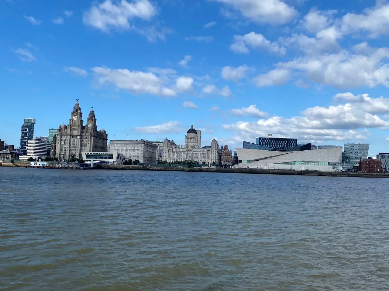 View of Royal Liver Building and Museum of Liverpool from the River Mersey