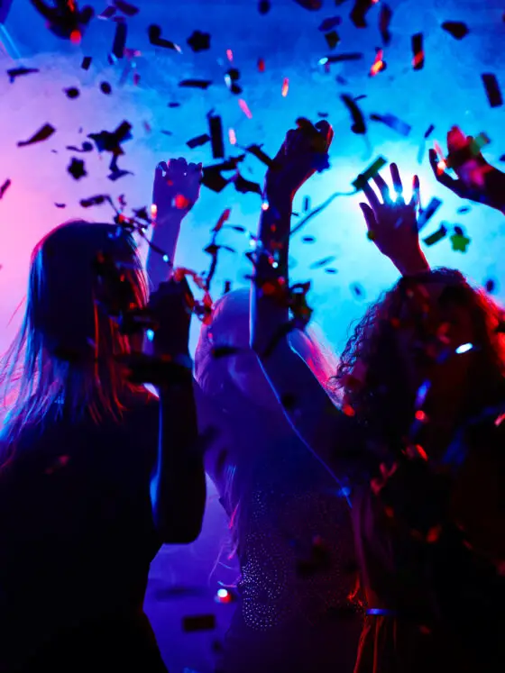 People partying in a dark nightclub