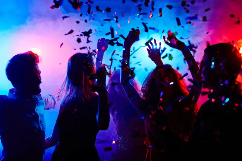 People partying in a dark nightclub