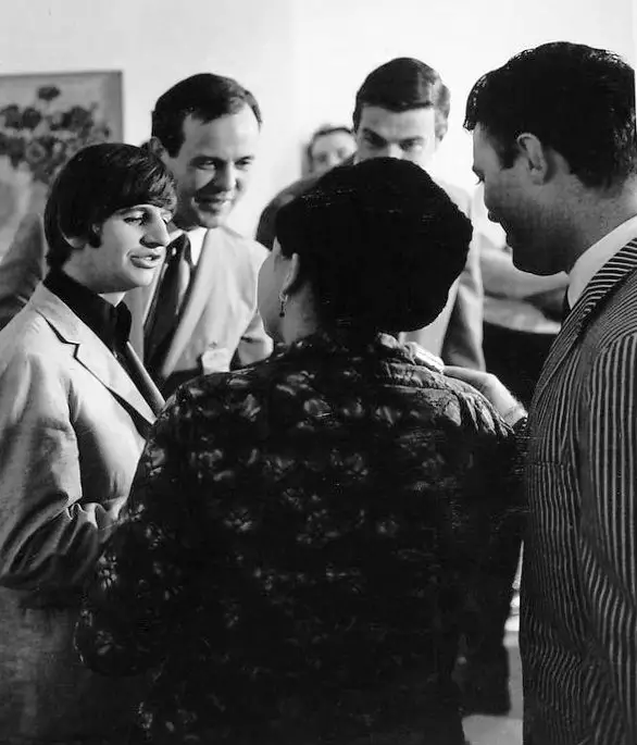 Ringo Starr in conversation with Beatles manager Brian Epstein and others in 1965. There are two Beatles songs written by Ringo in the 1960s