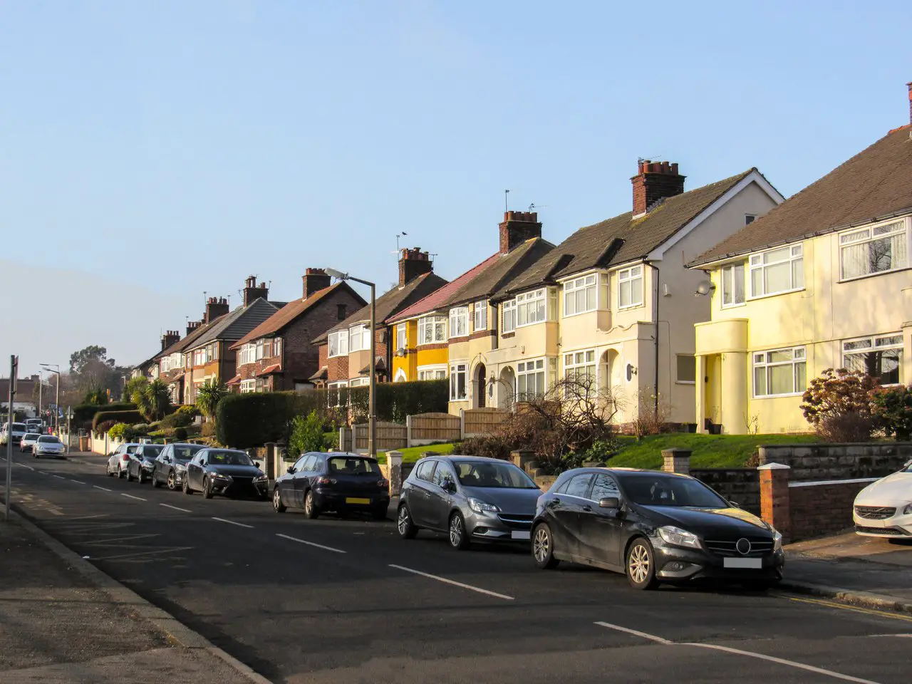 A street of semi-detached houses in Liverpool. Since the Liverpool cost of living is lower than London, you can get a far bigger house for your money.